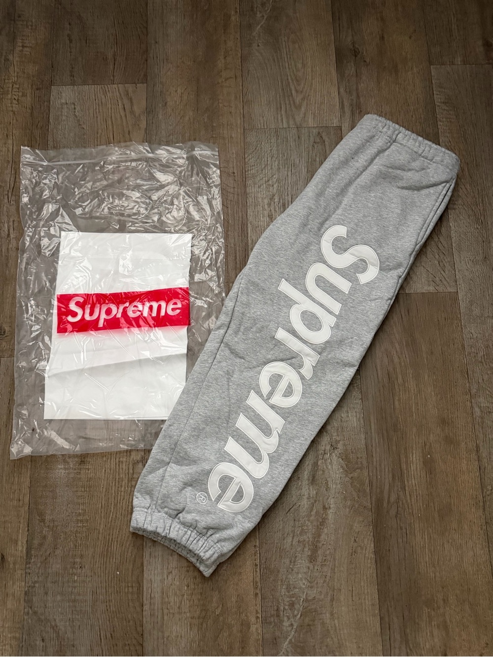 Supreme Grey Sweatpants with White Vertical Logo
